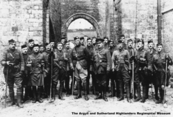9th-Bn-Officers2C-Ypres-Cathederal-04-04-1915edit2.jpg